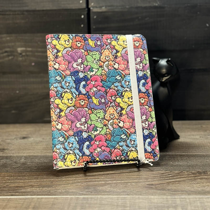 notepad holder featuring colorful cartoon bears