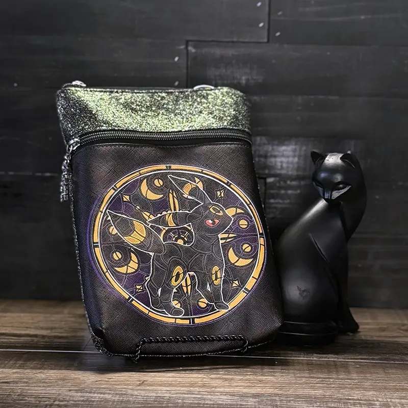 small wristlet pouch with black and white and color design