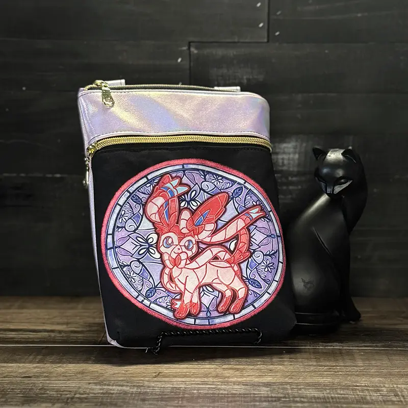 small crossbody phone bag with a wolf design in blue