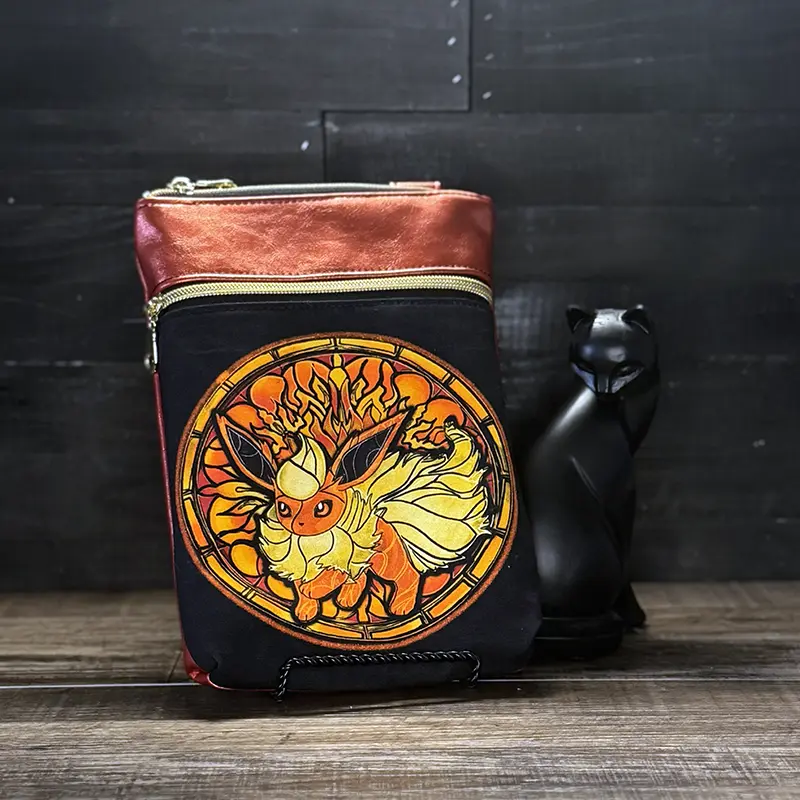 small crossbody phone bag with a wolf design in blue