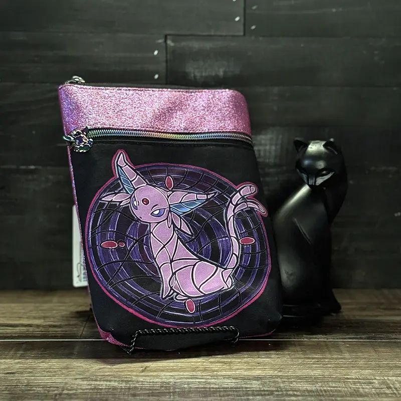 small crossbody phone bag with a wolf design in blue