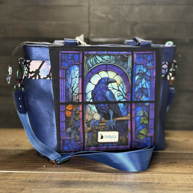 handmade tote bag with a colorful stained glass raven design