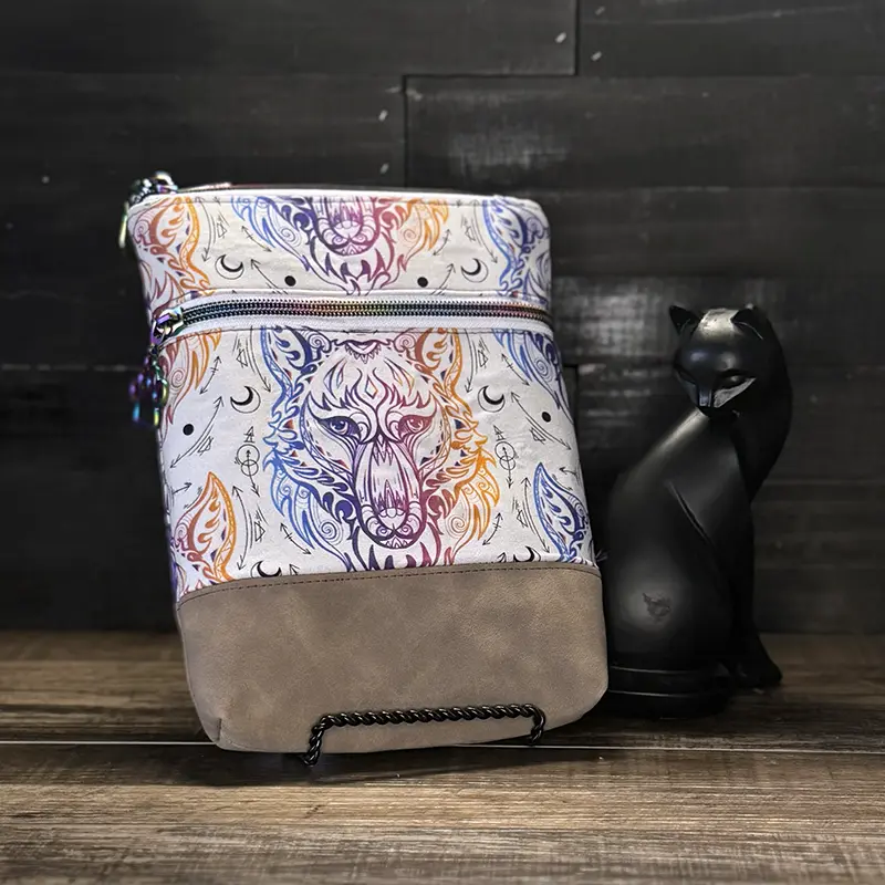 small crossbody phone bag with a wolf design in blue
