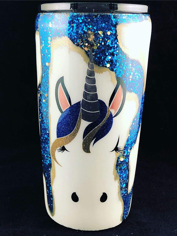 cup with a unicorn decoration and paint rubbed away to reveal glitter